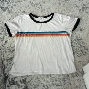 White shirt with colors across it